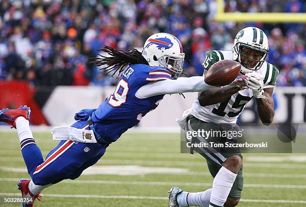 Mario Butler of the Buffalo Bills breaks up a reception intended for Brandon Marshall of the New York Jets during the second half at Ralph Wilson...