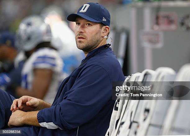 Tony Romo of the Dallas Cowboys sits on the bench late in the fourth quarter as the Washington Redskins beat the Dallas Cowboys 34-23 at AT&T Stadium...