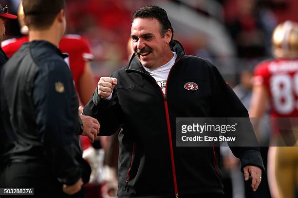 Head coach Jim Tomsula of the San Francisco 49ers stands on the field during warm ups prior to playing the St. Louis Rams in their NFL game at Levi's...