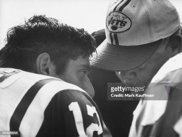 New York Jets coach Weeb Ewbank talking with quarterback Joe Namath during a game against the Houston Oilers.