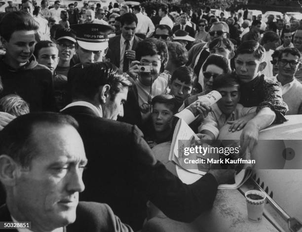 New York Jets quarterback Joe Namath signing autographs after a game against the Houston Oilers.