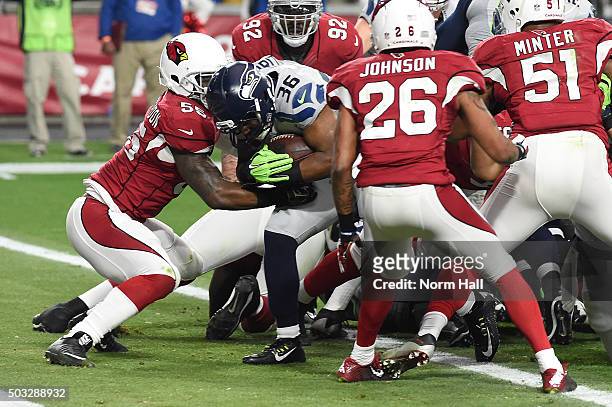 Running back Bryce Brown of the Seattle Seahawks rushes the football one yard against linebacker Sean Weatherspoon of the Arizona Cardinals to score...