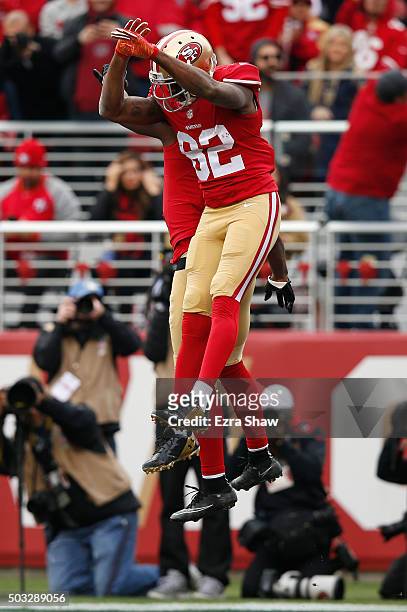 Anquan Boldin and Torrey Smith of the San Francisco 49ers celebrate after a 33-yard touchdown catch by Boldin against the St. Louis Rams during their...