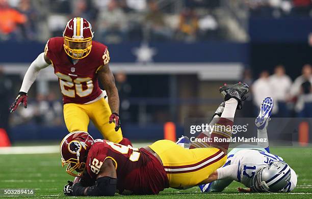 Chris Baker of the Washington Redskins makes a fumble recovery against Kellen Moore of the Dallas Cowboys at AT&T Stadium on January 3, 2016 in...