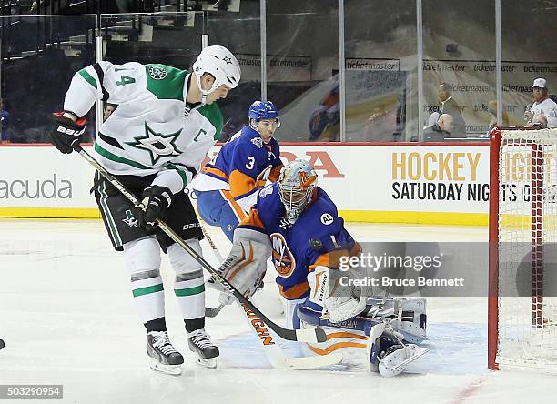 Thomas Greiss of the New York Islanders makes the first period save on Jamie Benn of the Dallas Stars at the Barclays Center on January 3, 2016 in...