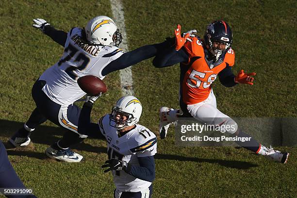 Linebacker Von Miller of the Denver Broncos battled the block of offensive tackle Joe Barksdale of the San Diego Chargers as he pursues quarterback...