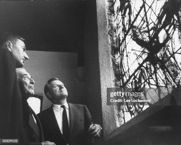 Gov. Nelson A. Rockefeller and David Rockefeller with artist, Marc Chagall, attending dedication of stained glass window, of his design, at UN.