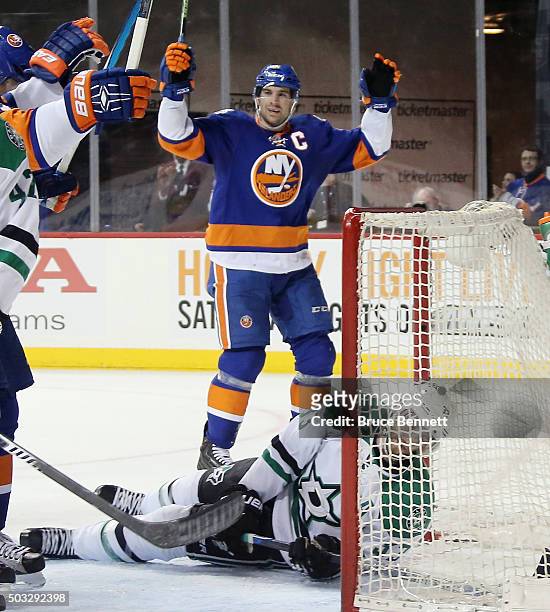 John Tavares of the New York Islanders celebrates a power play goal by Kyle Okposo at 8:13 of the second period against the Dallas Stars as Alex...
