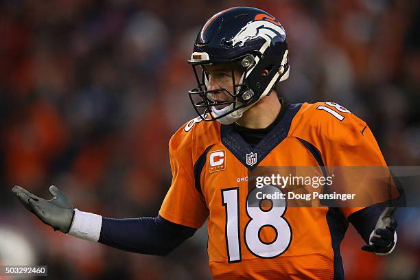 Quarterback Peyton Manning of the Denver Broncos reacts after a one yard touchdown run by C.J. Anderson of the Denver Broncos to take a 14-13 lead...