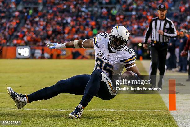 Tight end Antonio Gates of the San Diego Chargers scores a touchdown on a 13-yard reception in the third quarter of a game against the Denver Broncos...