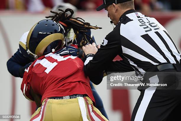 Janoris Jenkins of the St. Louis Rams and Bruce Ellington of the San Francisco 49ers scuffle after a play during their NFL game at Levi's Stadium on...