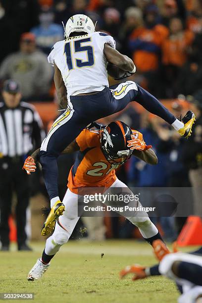 Wide receiver Dontrelle Inman of the San Diego Chargers tries to hurdle Aqib Talib of the Denver Broncos on a pass reception in the fourth quarter at...