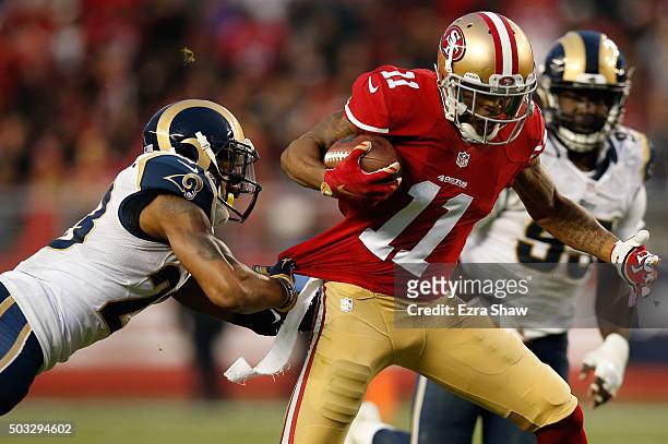 Quinton Patton of the San Francisco 49ers breaks a tackle during his 33-yard pass play to setup the game winning field goal in overtime against the...