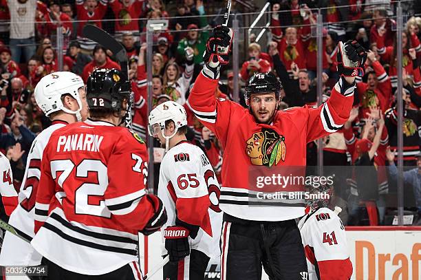 Artem Anisimov of the Chicago Blackhawks reacts after scoring against the Ottawa Senators in the third period of the NHL game at the United Center on...