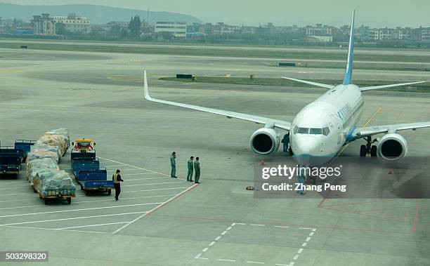 Passenger plane stops on tarmac for ground service before take off. The year of 2015 is the most profitable year for Chinas aviation industry. In...