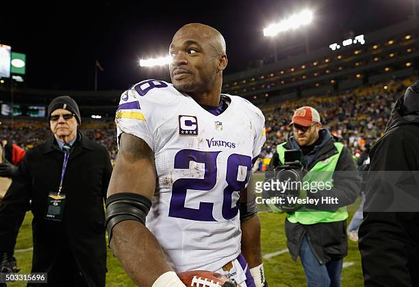 Adrian Peterson of the Minnesota Vikings reacts after defeating the Green Bay Packers with a score of 20 to 13 at Lambeau Field on January 3, 2016 in...