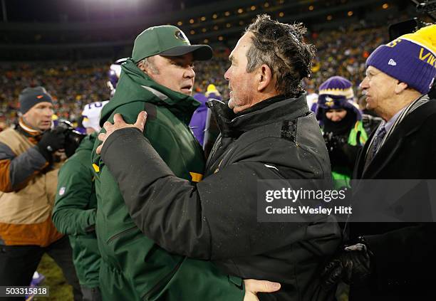 Head coach Mike McCarthy of the Green Bay Packers greets head coach Mike Zimmer of the Minnesota Vikings after their game at Lambeau Field on January...