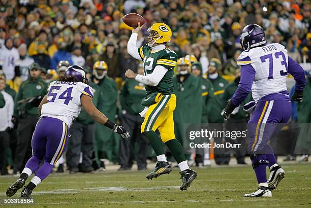 Aaron Rodgers of the Green Bay Packers throws a pass during the fourth quarter against the Minnesota Vikings at Lambeau Field on January 3, 2016 in...