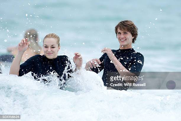 Sabine Lisicki and Alexander Zverev of Germany have a surfing lesson at Trigg beach during day two of the 2016 Hopman Cup at Perth Arena on January...