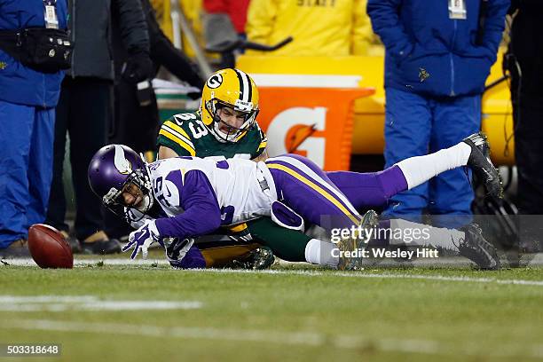 Marcus Sherels of the Minnesota Vikings muffs the catch on a kickoff return during the second quarter against the Green Bay Packers at Lambeau Field...