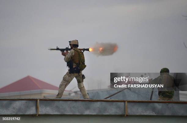 An Afghan Quick Reaction Force soldier fires a rocket-propelled grenade launcher during an operation near the Indian consulate in Mazar-i-Sharif on...