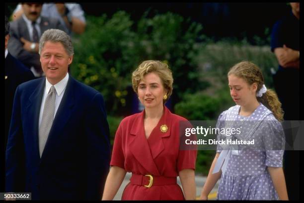 Pres. Bill & Hillary Rodham Clinton, daughter Chelsea in-tow, walking on Regis Univ. Campus during World Youth Day fete appearance by Pope John Paul...