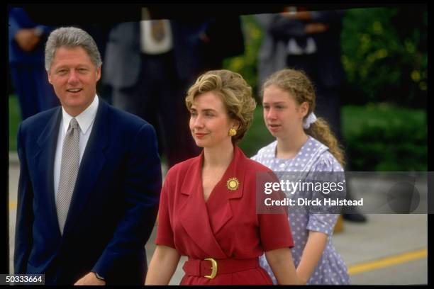 Pres. Bill & Hillary Rodham Clinton, daughter Chelsea in-tow, walking on Regis Univ. Campus during World Youth Day fete appearance by Pope John Paul...