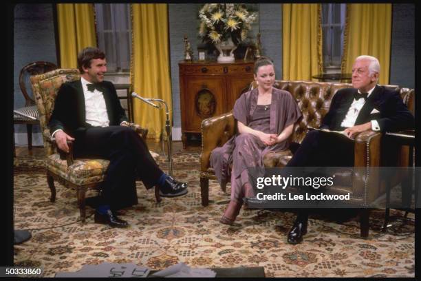 Alistair Cooke, host of the TV series, Upstairs, Downstairs sitting on set of Boston station WGBH w. Jacqueline Tong and Chris Beeny for farewell...