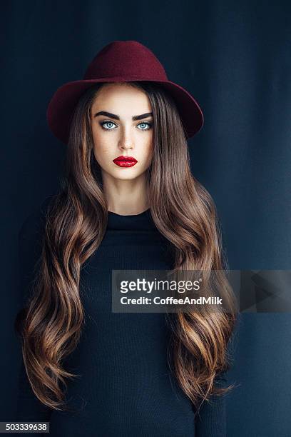 beautiful girl wearing hat - long hair stock pictures, royalty-free photos & images