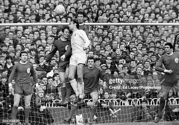 Tottenham Hotspur striker Alan Gilzean is challenged by Tommy Smith and Geoff Strong of Liverpool, watched by Chris Lawler , goalkeeper Tommy...
