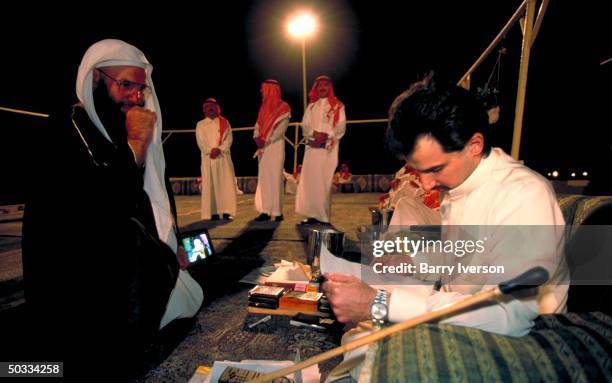 Billionaire investor Saudi Prince Alwaleed holding night mtg. W. Saudi tribal leaders at his weekend desert retreat 45 miles from Riyadh.