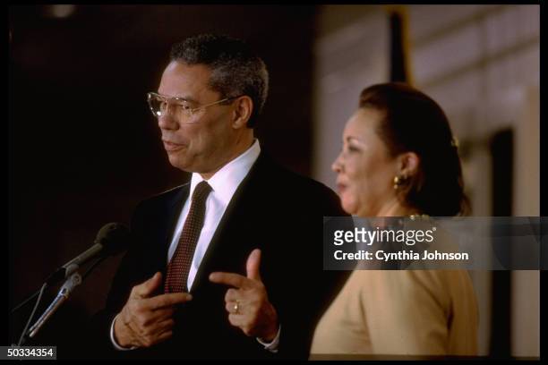 Retired Gen. Colin Powell announcing his decision not to run for pres. In 1996 w. His wife Alma by his side.