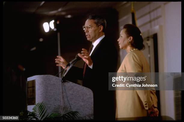 Retired Gen. Colin Powell announcing his decision not to run for pres. In 1996 w. His wife Alma by his side.