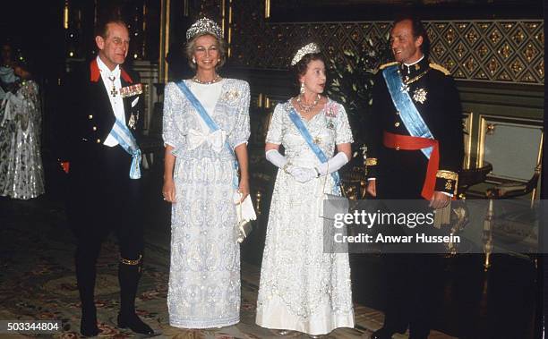 Queen Elizabeth ll, Prince Philip, Duke of Edinburgh, King Juan Carlos of Spain and Queen Sophia attend a State Banquet at Windsor Castle on April...