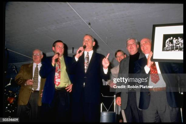 The Murray brothers Ed, Joel, Bill, John, Andy and Brian auctioning a photo of themselves at a benefit for Paul Newman's Hole-In-The-Wall Gang camp...