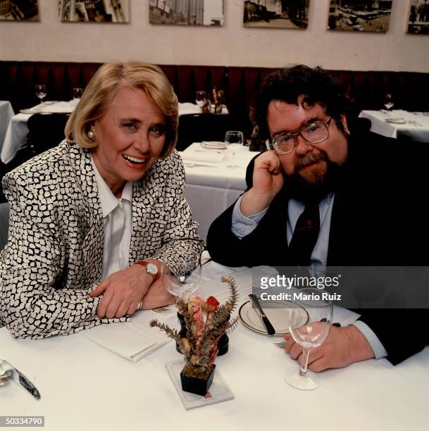 Writer William Henry III & gossip columnist Liz Smith seated in Time Inc.'s corporate dining room.