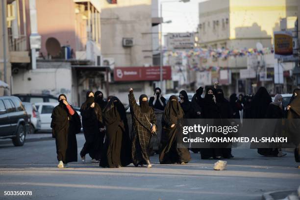 Bahraini women shout slogan during clashes with riot police following a protest against the execution of prominent Shiite Muslim cleric Nimr al-Nimr...