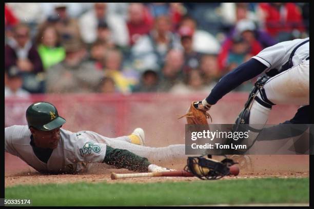 Oakland A's Rickey Henderson in action sliding vs Milwaukee Brewers Joe Oliver. Sequence.