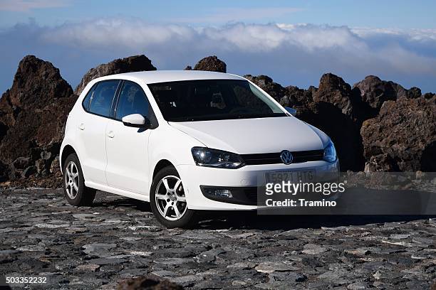 volkswagen polo stopped on the road - volkswagen polo stock pictures, royalty-free photos & images