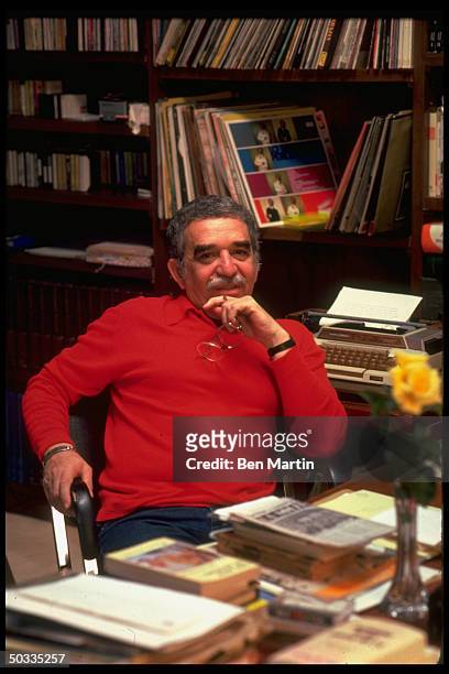 Colombian author Gabriel Garcia Marquez in affable portrait at his desk.