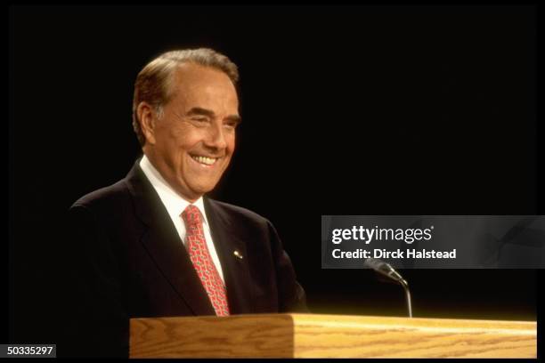 Republican presidential candidate Bob Dole in smiling portrait during his 1st election campaign debate w. Democratic incumbent Bill Clinton.