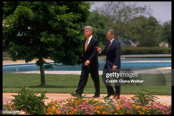 President Bill Clinton strolling w. His host Brazilian President Fernando Henrique Cardoso.