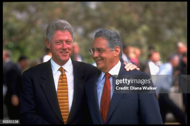 President Bill Clinton w. Affectionate arm around his host Brazilian President Fernando Henrique Cardoso.