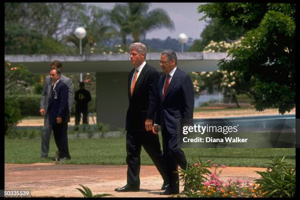 President Bill Clinton strolling w. His host Brazilian President Fernando Henrique Cardoso.