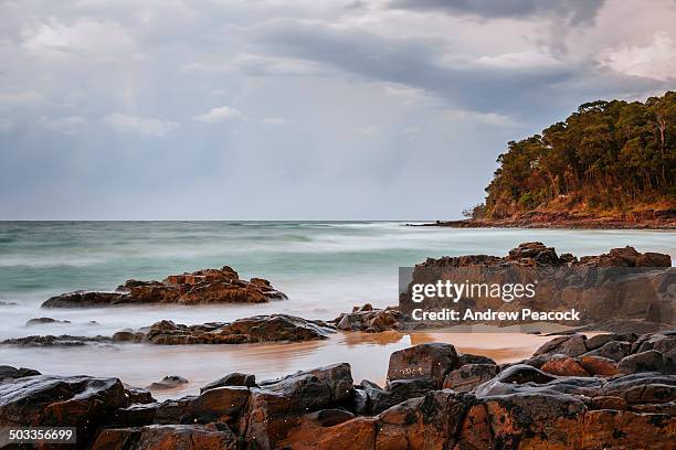 little cove in laguna bay on a stormy evening - noosa heads stock pictures, royalty-free photos & images
