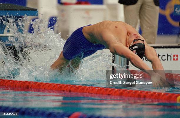 American swimmer Lenny Krayzelburg bounding off side at start of 200m Men's Backstroke Final at 2000 Summer Olympics in gold medal performance.