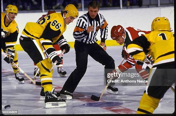 Pitts. Penguins Mario Lemieux in action, facing off vs New Jersey Devils Kirk Muller.