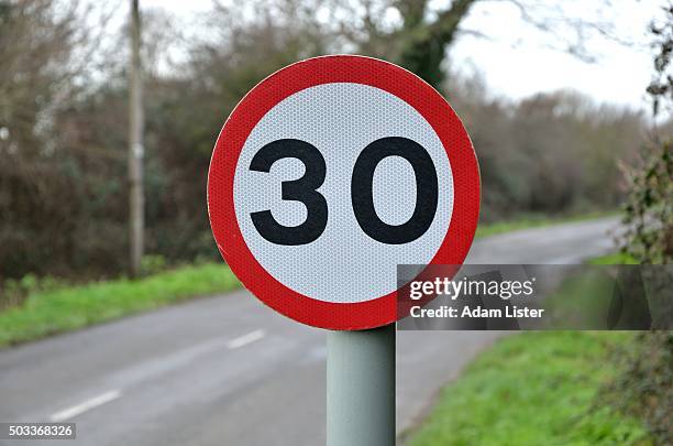 speed limit on country road - speed limit sign stock pictures, royalty-free photos & images