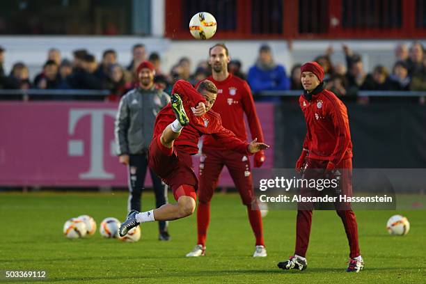 Joshua Kimmich of Bayern Muenchen battles for the ball during a training session at Bayern Muenchen's trainings ground Saebener Strasse on January 4,...