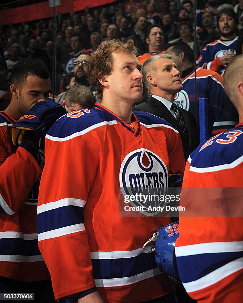 Nikita Nikitin of the Edmonton Oilers stands for the singing of the national anthem prior to a game against the Winnipeg Jets on December 21, 2015 at...